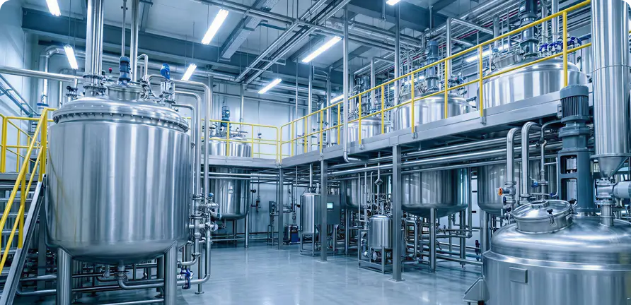 Industrial tanks inside a manufacturing facility